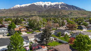 Aerial view of residential area featuring a mountainous background