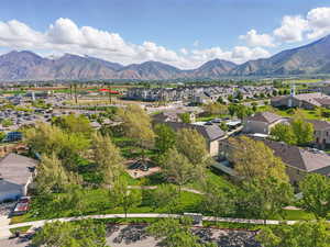 Aerial view of residential area with a mountainous background and HOA playground