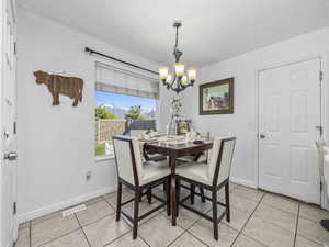 Dining space featuring a chandelier
