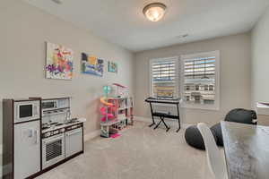 Bedroom featuring carpet flooring recessed lighting, and baseboards