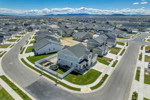 Aerial view of residential area featuring a mountain backdrop