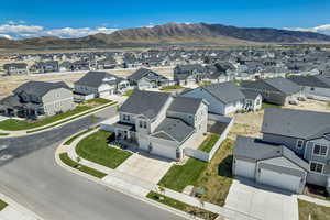 Aerial perspective of suburban area featuring a mountain backdrop