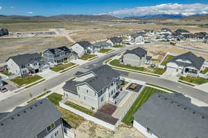 Aerial perspective of suburban area featuring a mountain backdrop