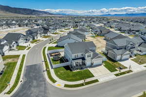 Aerial perspective of suburban area featuring a mountain backdrop