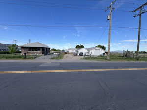 Corner Lot Showing Single Family Residence, Barns and Outbuildings Comprising 3.93 Acres