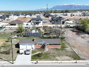 Aerial view of residential area featuring a mountainous background