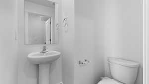 Bathroom featuring toilet and a sink