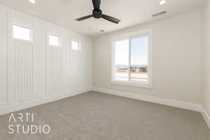 Spare room with light carpet, healthy amount of natural light, baseboards, and recessed lighting