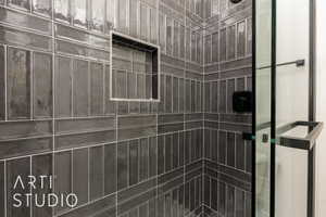 Full bath featuring a shower stall