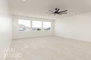 Spare room featuring recessed lighting, light colored carpet, ceiling fan, and baseboards