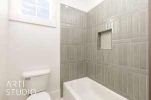 Full bathroom featuring toilet