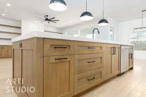 Kitchen with a ceiling fan, light wood-style floors, light brown cabinetry, light countertops, and recessed lighting