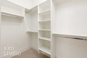 Spacious closet with carpet