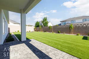 View of yard with a patio area and a residential view
