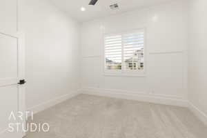 Carpeted spare room featuring ceiling fan, baseboards, and recessed lighting
