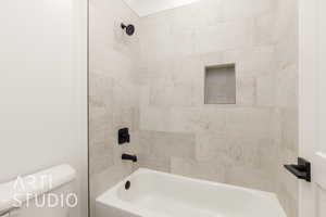 Bathroom with toilet and washtub / shower combination