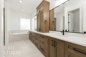 Full bath with double vanity, a garden tub, tile patterned flooring, and recessed lighting