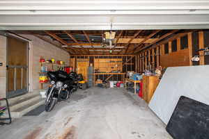 Garage featuring concrete block wall