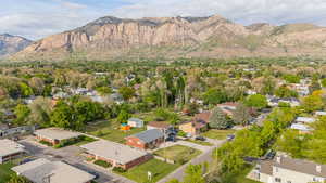Aerial view of residential area featuring a mountainous background
