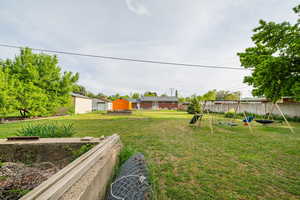 View of yard featuring a playground