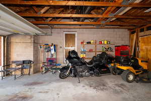 Garage featuring concrete block wall