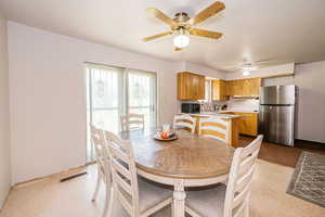 Dining space with ceiling fan
