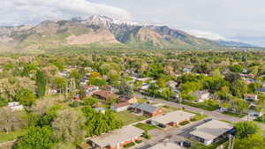 Aerial perspective of suburban area with a mountain backdrop