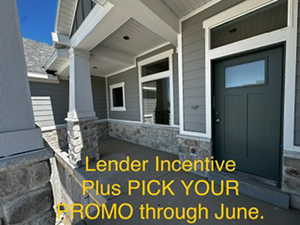 Doorway to property featuring a porch and stone siding