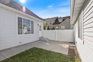 View of patio / terrace featuring fence, entry steps, and a residential view