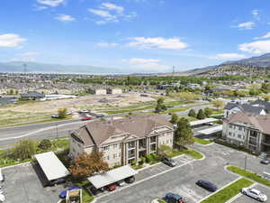 Aerial perspective of suburban area featuring a mountain backdrop