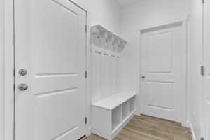 Mudroom featuring light wood-style floors