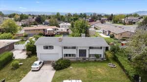 Aerial view of residential area featuring a mountain backdrop