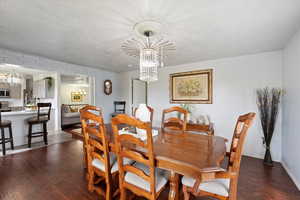 Dining area, wood-type flooring, and baseboards