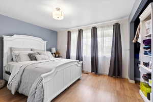 Bedroom with light wood-style flooring
