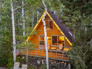 View of front of home with roof with shingles