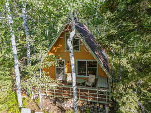View of home's exterior with roof with shingles