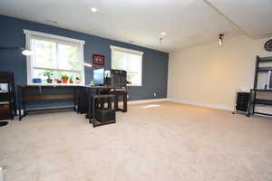 Office area featuring carpet and baseboards