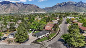 Aerial perspective of suburban area with a mountain backdrop