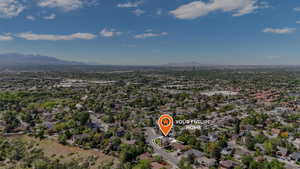 View of property location with mountains and nearby suburban area