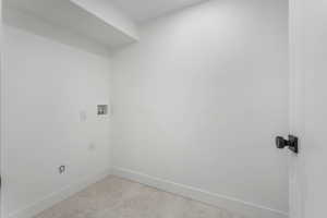 Laundry room with baseboards, hookup for an electric dryer, and washer hookup