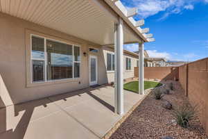 View of patio with a fenced backyard