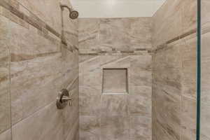 Bathroom view of a tile shower