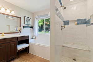 Primary bathroom with separate tub and shower