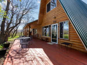 Wooden terrace featuring outdoor dining space