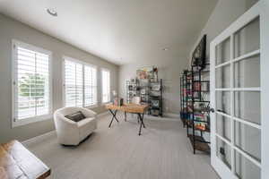 Office area with carpet floors, baseboards, and recessed lighting