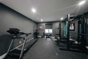 Workout area featuring baseboards and recessed lighting