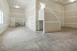 View of garage with walk-out basement