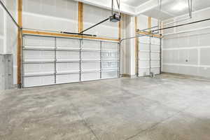 Garage featuring a garage door opener