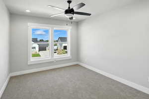Unfurnished room with carpet, ceiling fan, and recessed lighting