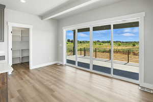 Spare room featuring light wood finished floors and recessed lighting